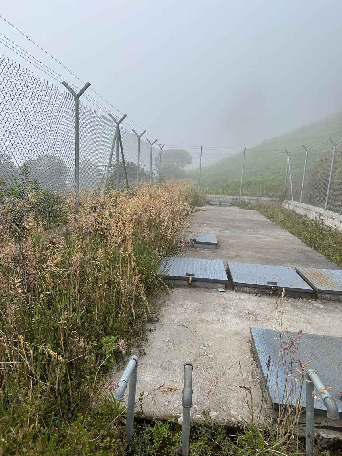 Water tank lids and piping at the irrigation site in Nabuzo, Ecuador